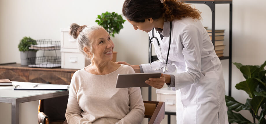 Elderly lady been taken care of by female doctor 